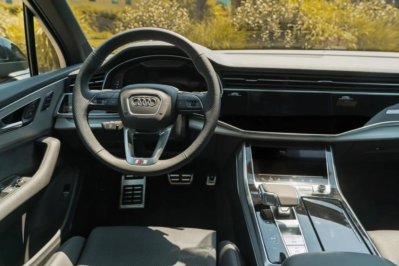 Audi Q7 50 TDI S-Line Edition 2025, interior — Milan Luxury Cars, Milan. The 2025 Audi Q7 50 TDI S-Line Edition brings a diesel-tuned 286 hp drivetrain to a cabin…