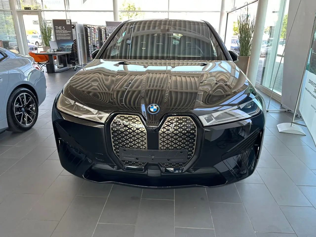 BMW IX M60 2023, front view — Milan Luxury Cars, Milan. The BMW iX M60 brings 619 hp to a five-seat SUV body without the theatre of a combustion…