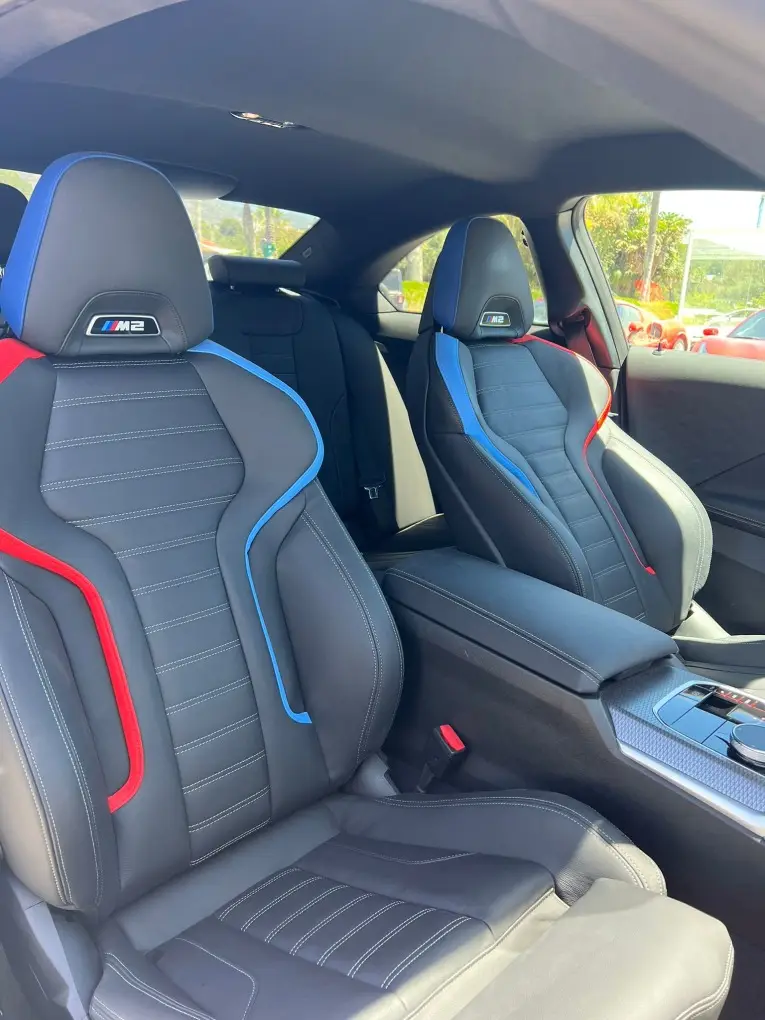 BMW M2 2024, rear view — Milan Luxury Cars, Milan. The 2024 BMW M2 pairs a 460 hp engine with a compact two-door body, giving it a…