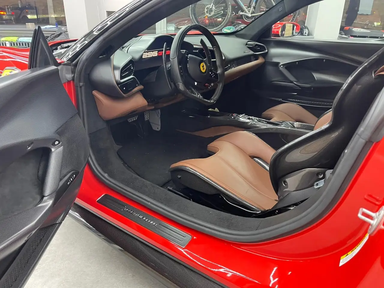 Ferrari 296 GTB 2023, exterior — Milan Luxury Cars, Milan. The Ferrari 296 GTB pairs a V6 hybrid powertrain with 830 hp, a combination that gives it…