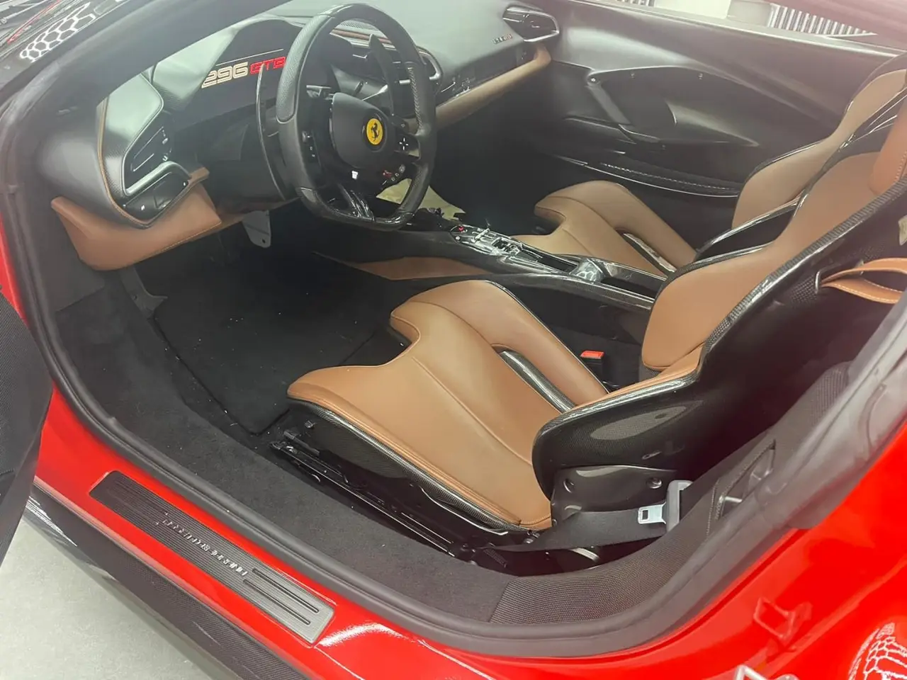 Ferrari 296 GTB 2023, dashboard — Milan Luxury Cars, Milan. The Ferrari 296 GTB pairs a V6 hybrid powertrain with 830 hp, a combination that gives it…