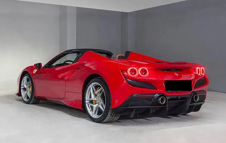 Ferrari F8 Tributo Spider Red 2023, interior — Milan Luxury Cars, Milan. The Ferrari F8 Tributo Spider pairs a 720 hp V8 with a retractable hardtop, giving two…