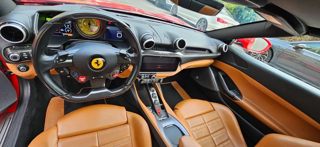Ferrari Portofino M 2023, exterior — Milan Luxury Cars, Milan. The Ferrari Portofino M pairs a 620 hp V8 with a retractable hard top, giving it a dual…