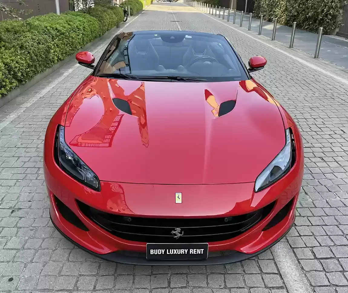 Ferrari Portofino M 2023, interior — Milan Luxury Cars, Milan. The Ferrari Portofino M pairs a 620 hp V8 with a retractable hard top, giving it a dual…