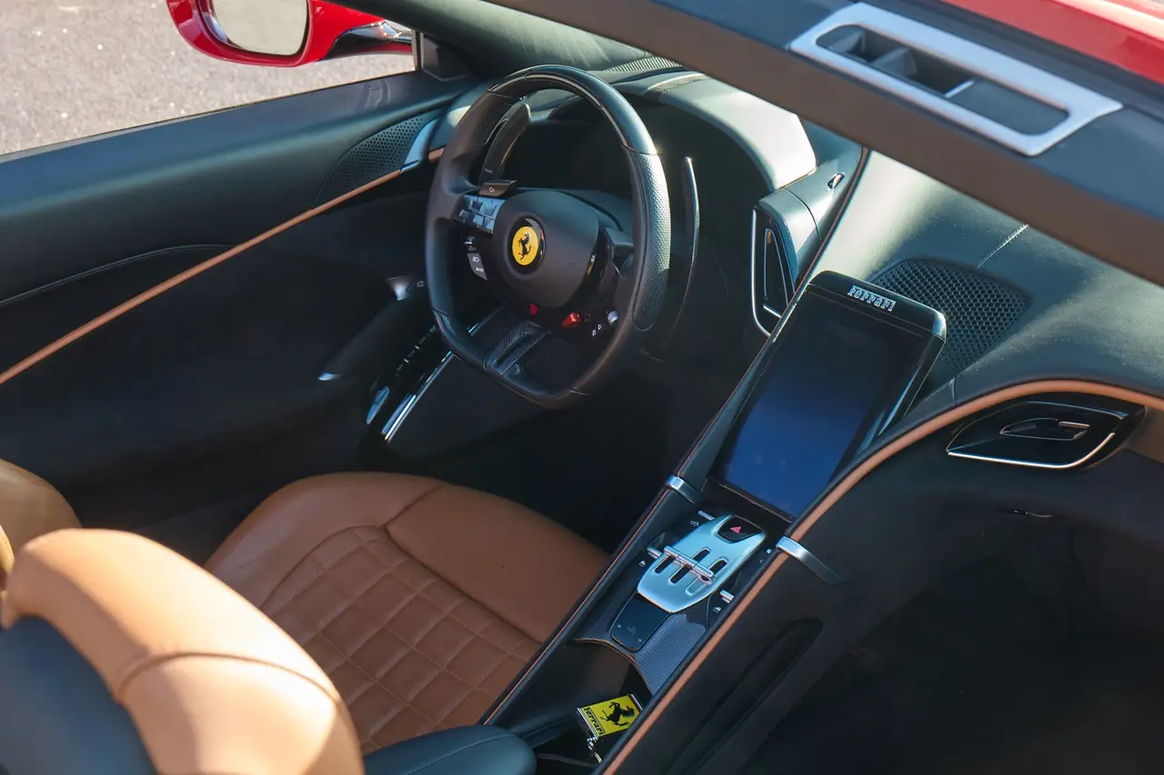 Ferrari Roma Spider 2024, rear view — Milan Luxury Cars, Milan. The Ferrari Roma Spider pairs a 620 hp V8 with a design language closer to a grand tourer…