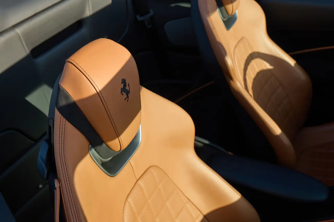 Ferrari Roma Spider 2024, interior — Milan Luxury Cars, Milan. The Ferrari Roma Spider pairs a 620 hp V8 with a design language closer to a grand tourer…