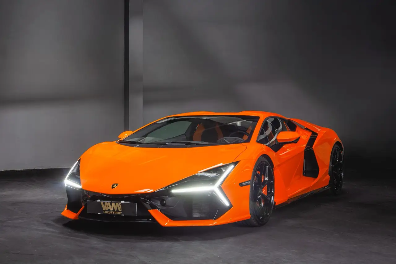 Lamborghini Revuelto 2026, front view — Milan Luxury Cars, Milan. The Lamborghini Revuelto is Lamborghini's current flagship, a two-seat hybrid V12…