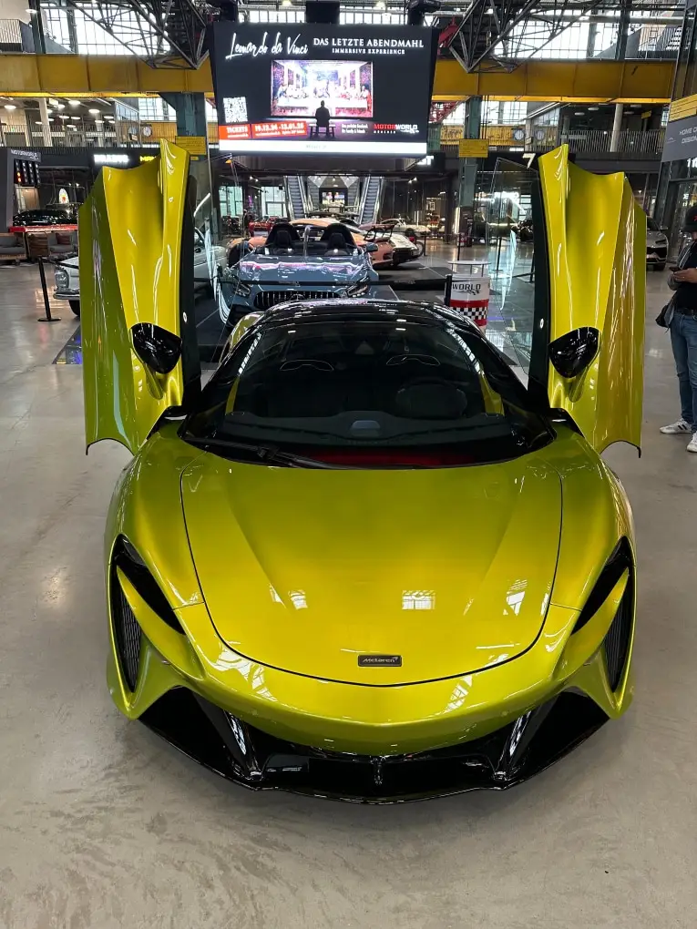 McLaren Artura Spider 2024, rear view — Milan Luxury Cars, Milan. The McLaren Artura Spider pairs a lightweight carbon structure with a hybrid V6 layout,…