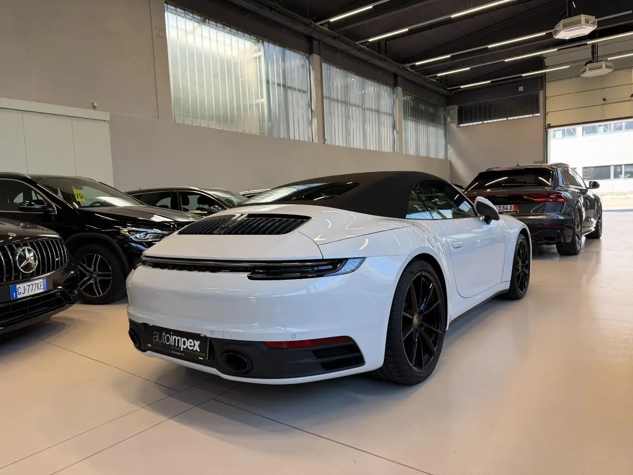 Porsche 911 Carrera S Cabrio (992) 2025, side profile — Milan Luxury Cars, Milan. The 2025 Porsche 911 Carrera S Cabrio (992) pairs a 480 hp flat-six with the everyday…