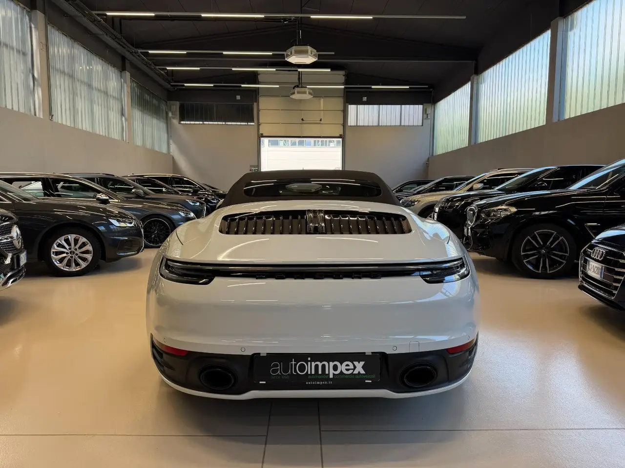 Porsche 911 Carrera S Cabrio (992) 2025, exterior — Milan Luxury Cars, Milan. The 2025 Porsche 911 Carrera S Cabrio (992) pairs a 480 hp flat-six with the everyday…