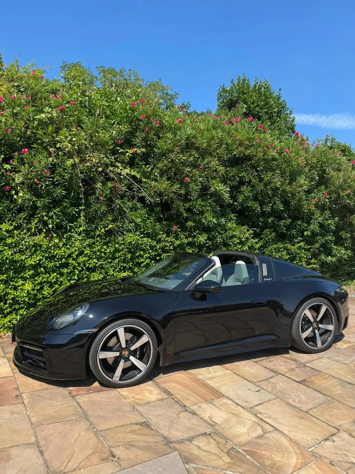 Porsche 911 Targa 2025, rear view — Milan Luxury Cars, Milan. The 911 Targa pairs 541 hp with the distinctive half-roof silhouette that sets it apart…