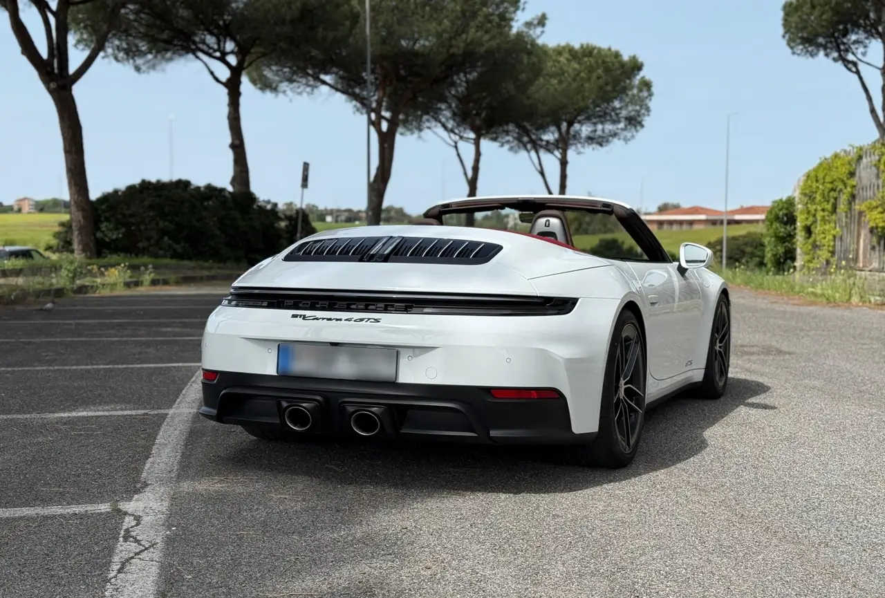 Porsche 992.2 Carrera 4 GTS Cabrio 2025, rear view — Milan Luxury Cars, Milan. The 2025 Porsche 992.2 Carrera 4 GTS Cabrio pairs 540 hp with all-wheel drive, a…