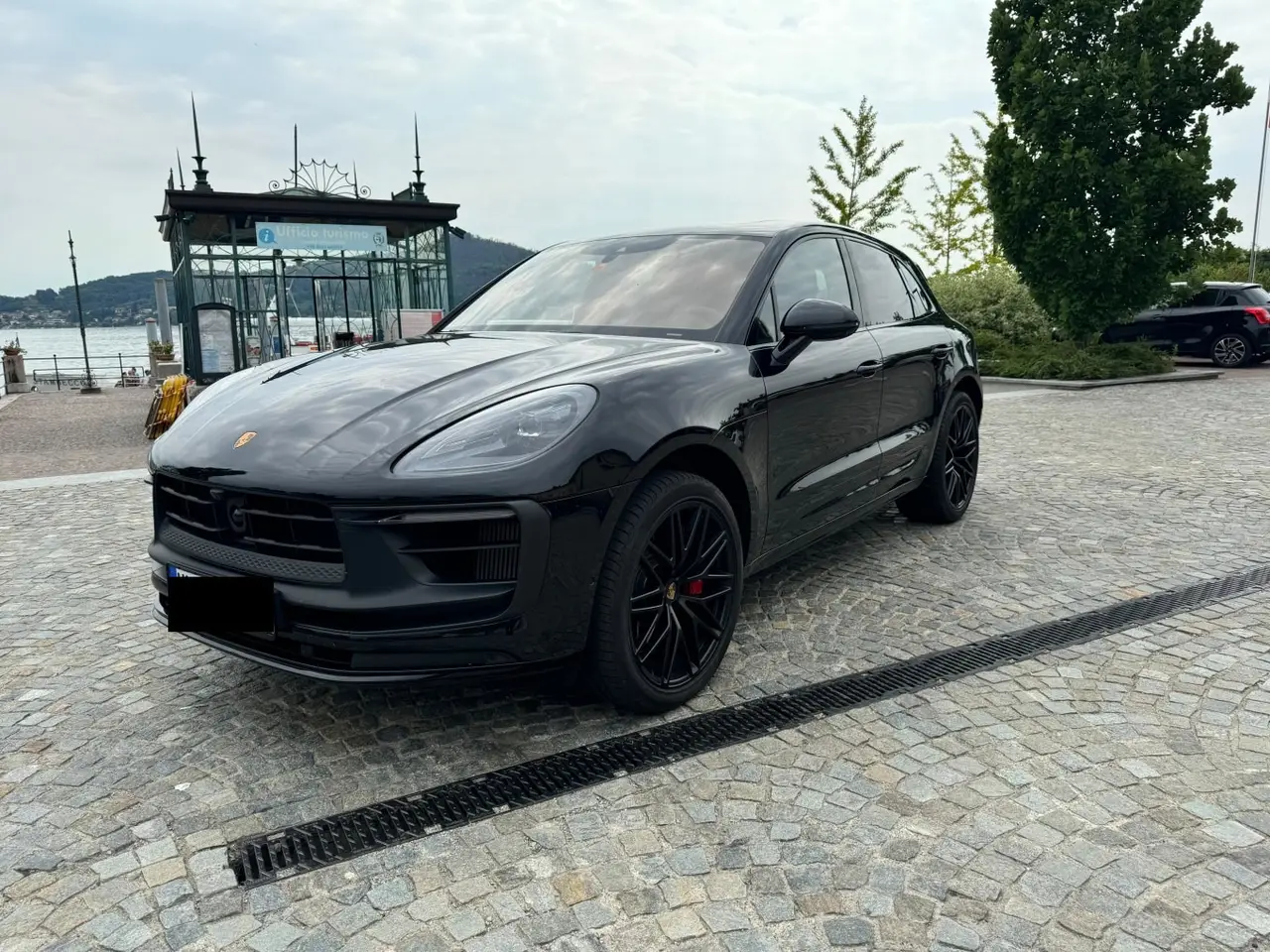 Porsche Macan GTS 2024, rear view — Milan Luxury Cars, Milan. The Porsche Macan GTS pairs 440 hp with the practicality of five seats, giving it a…